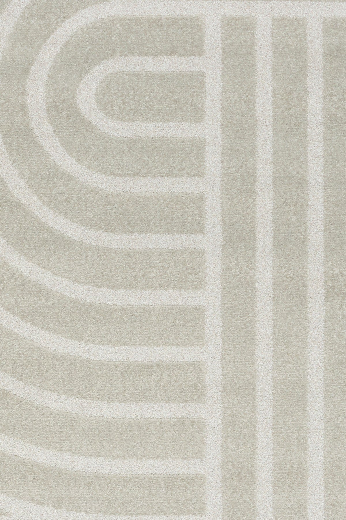 Light gray area rug with abstract arch and bar stripe pattern, close-up