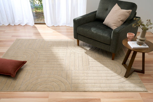 Beige geometric rug with arch-and-stripe design in living room