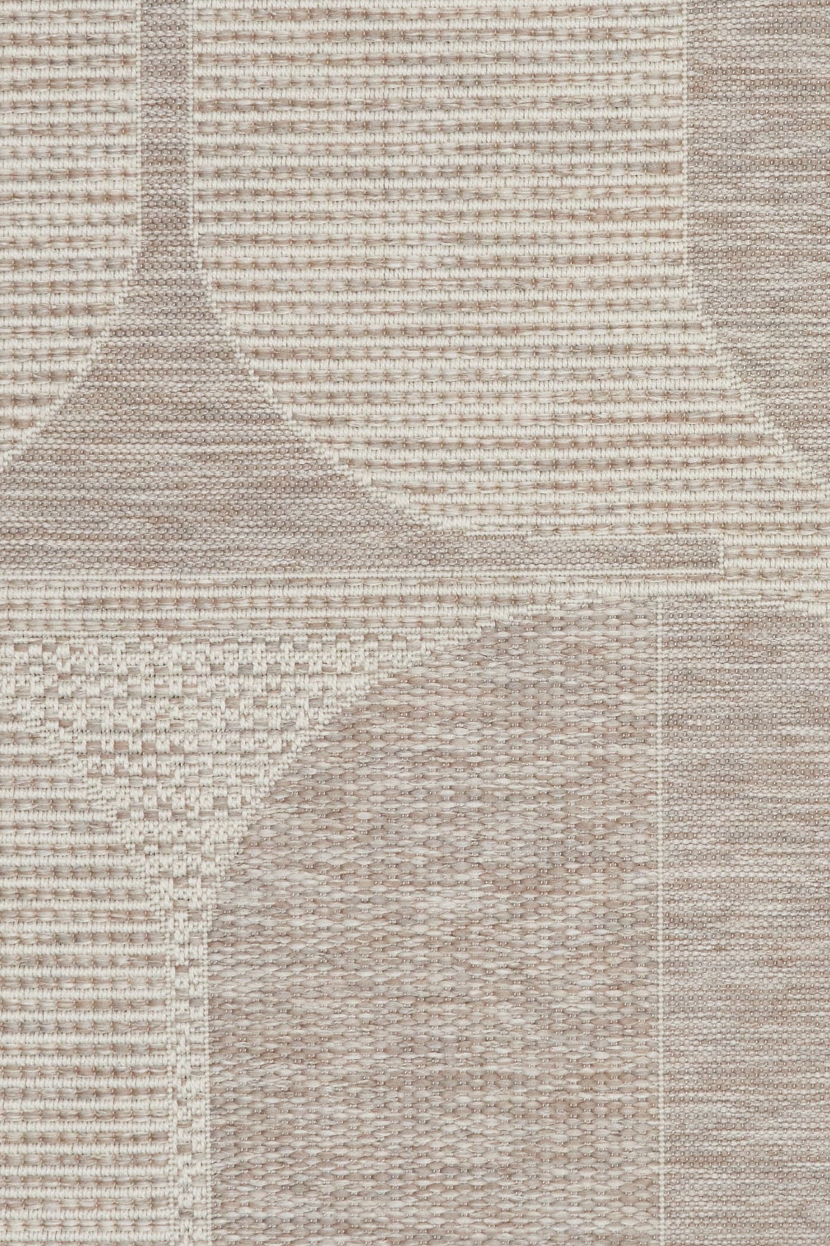 Linen patio rug close-up of woven texture with beige and taupe block pattern