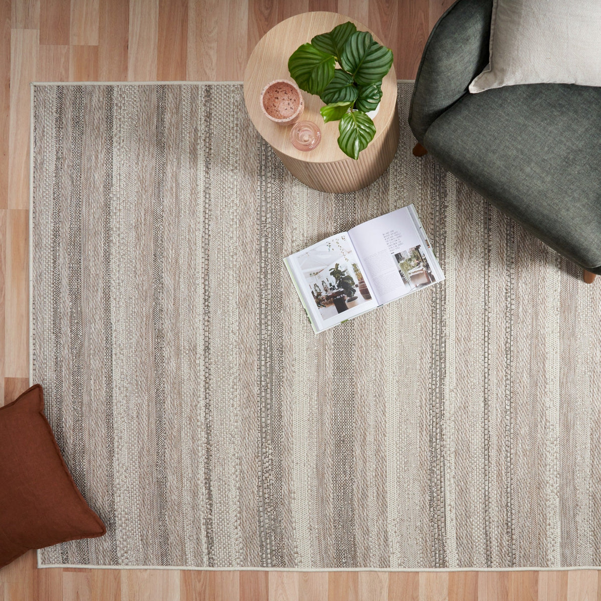 Patio 900 linen rug with vertical stripe pattern, flatlay in living area
