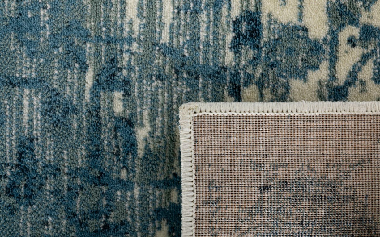 Rug edge close-up with stitched binding and woven backing | Raffia 7444 Sky Modern Polypropylene Area Rug - Rugs Point Australia