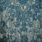 Close-up of blue rug texture with mottled abstract design | Raffia 7444 Sky Modern Polypropylene Area Rug - Rugs Point Australia