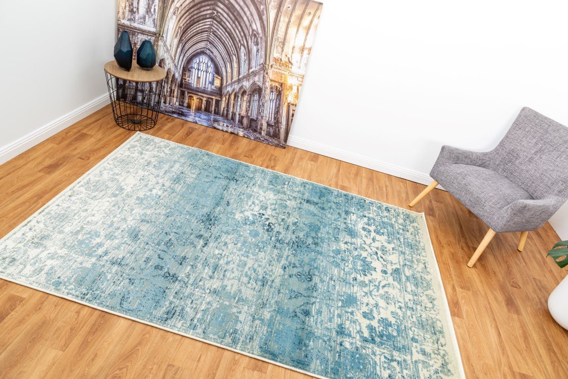 Sky blue area rug with distressed abstract pattern | Raffia 7444 Sky Modern Polypropylene Area Rug - Rugs Point Australia