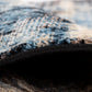Close-up of rug pile showing soft blue threads with black bound backing | Raffia Mat 1440 Sky Modern Abstract Living Room Rug - Rugs Point Australia