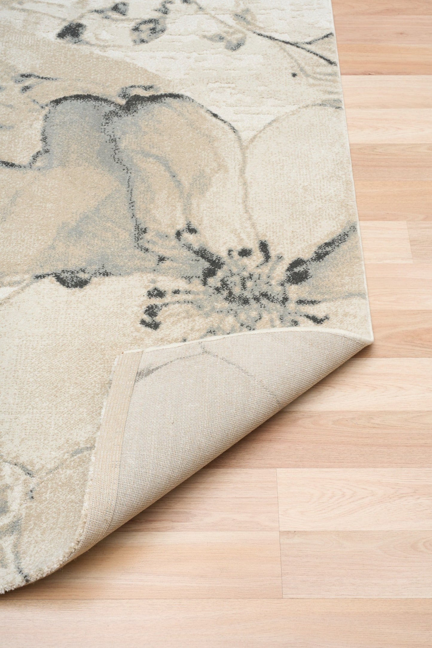 Beige area rug with blue-gray floral motif and rolled corner edge | Reims  Floral Beige Modern Belgian Recycled Polyester Area Rug Modern Abstract Floor Rug - Rugs Point Australia
