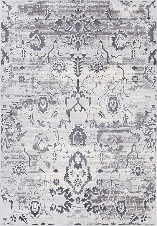 Traditional area rug in light stone gray with dark floral medallion and geometric border motifs