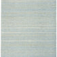 Rectangular light blue textured area rug with short pile, photographed flat for full view.
