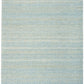 Rectangular light blue textured area rug with short pile, clean flat border, and even color.