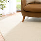 Cream woven area rug with visible loop texture and finished edge