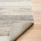 Bone grey rug corner showing backing and bound border detail