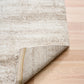 Bone cream area rug edge with beige binding and distressed texture pattern