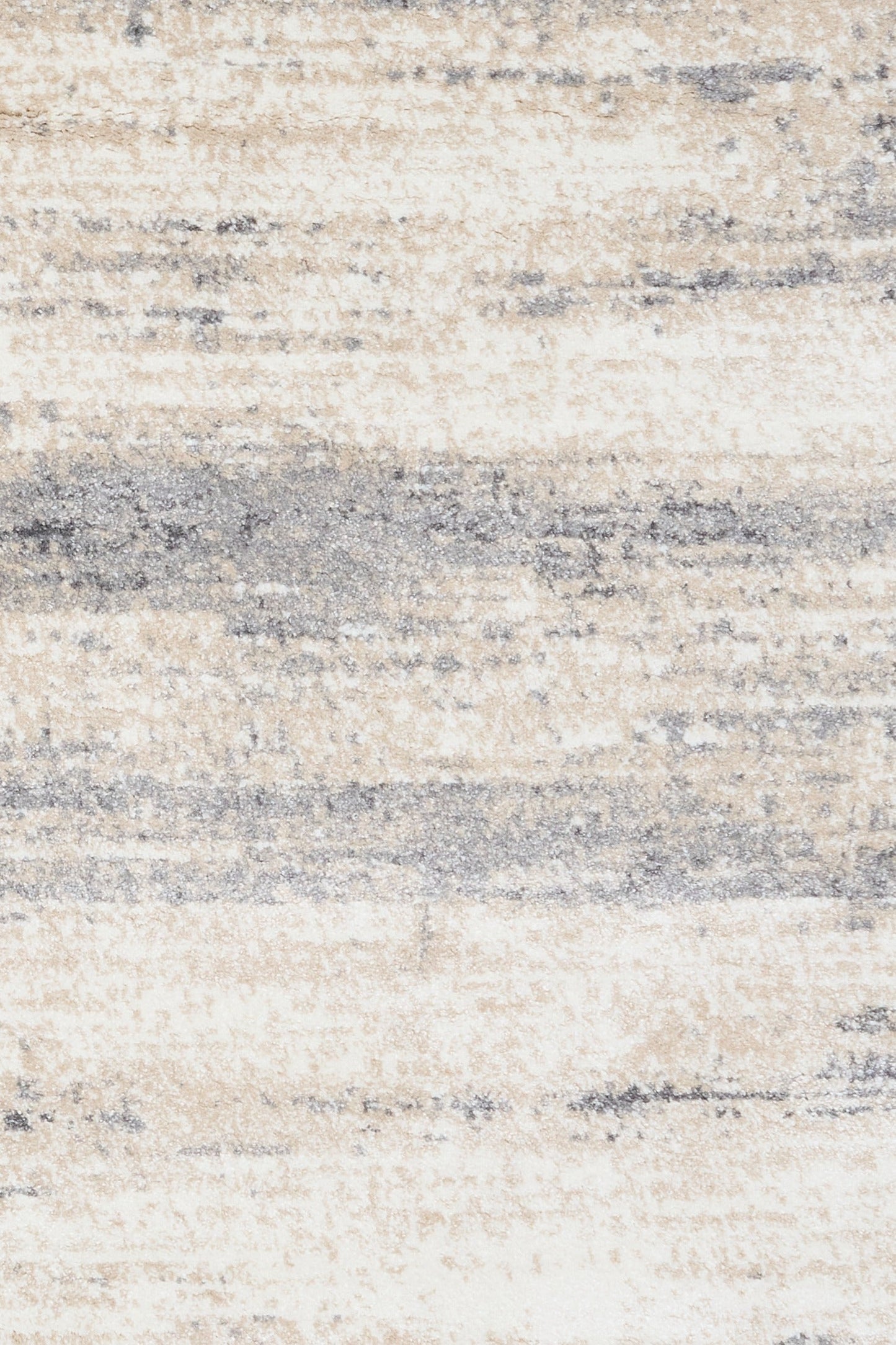 Grey and cream abstract area rug close-up, layered stripes and speckled texture