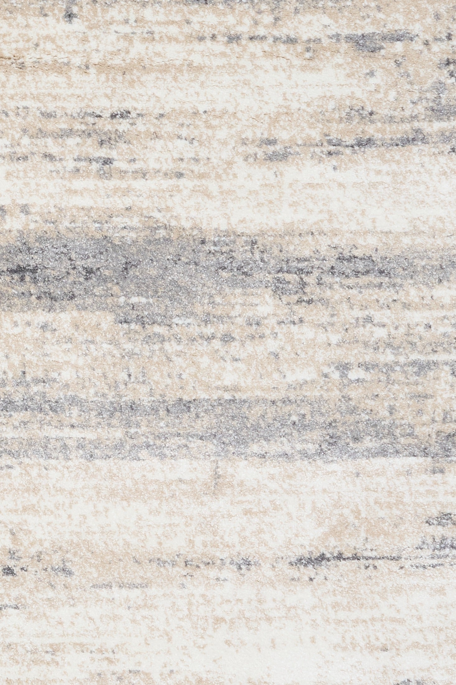 Grey and cream abstract area rug close-up, layered stripes and speckled texture