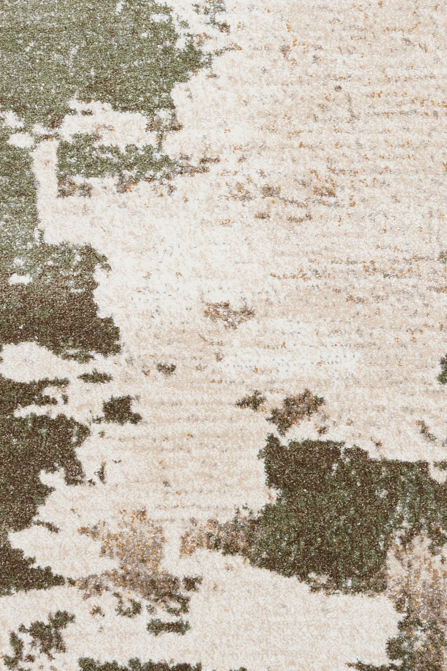 Close-up of green and cream abstract distressed area rug texture
