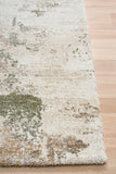 Green and cream abstract textured area rug corner with low pile edge binding
