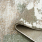 Green and cream abstract area rug with bound edge detail and textured pile