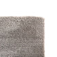 Grey rug close-up of short looped pile and straight selvedge edge