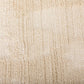Ivory shaggy area rug surface with fine vertical texture and dense pile