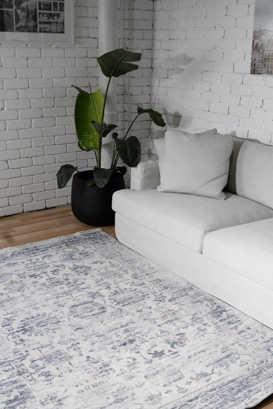 Ivory and blue distressed printed modern rug, medium size