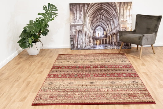 Red traditional Afghan rug with ornate border and central medallion pattern