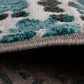 Grey-blue abstract area rug binding on edge, thick pile texture