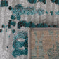 Abstract grey-and-teal area rug corner with border and flat-woven trim