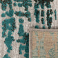 Corner detail of abstract rug with teal pattern and light woven edge backing