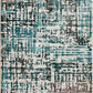Abstract area rug with teal, dark gray, and light gray pixel-like pattern