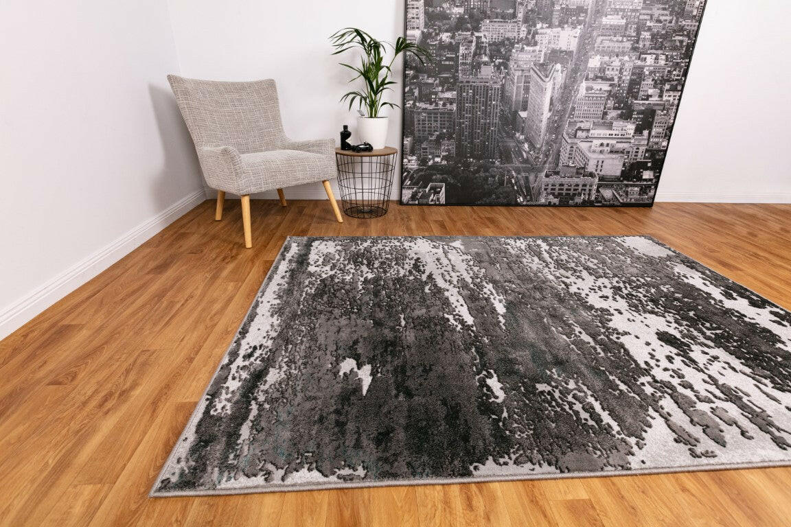 Modern area rug with gray and white distressed abstract pattern, flat weave