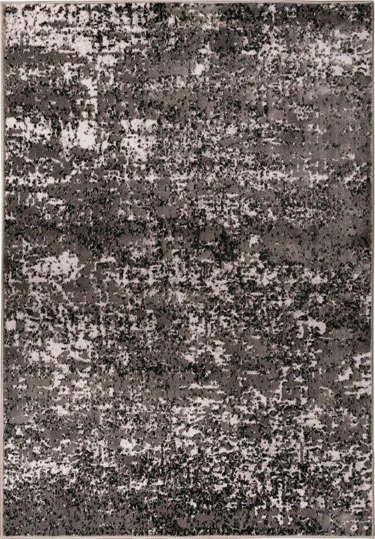 Rectangular area rug with dense black, gray, and white abstract speckle pattern.