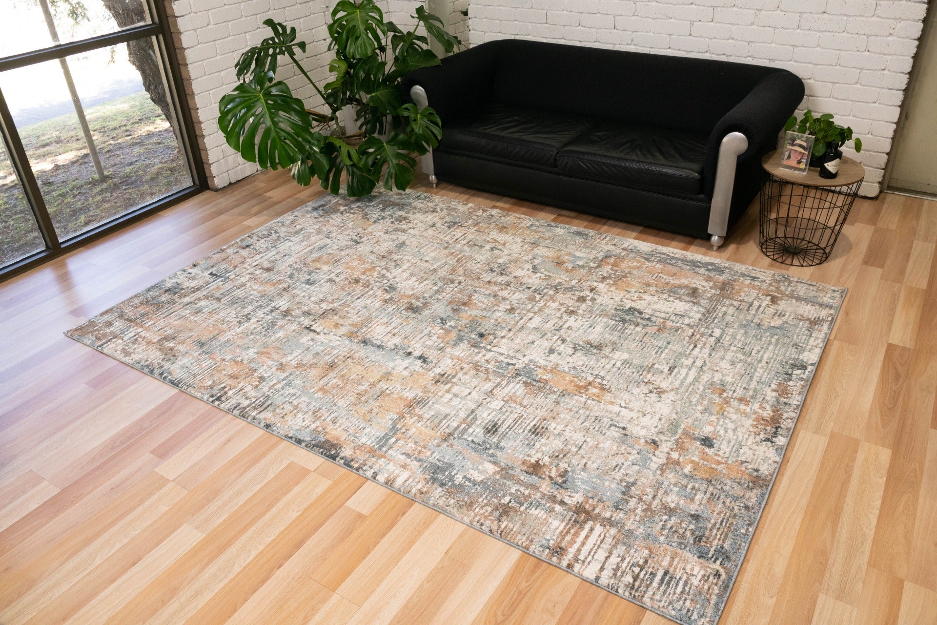 Multi-color area rug with distressed abstract pattern in light blue and beige