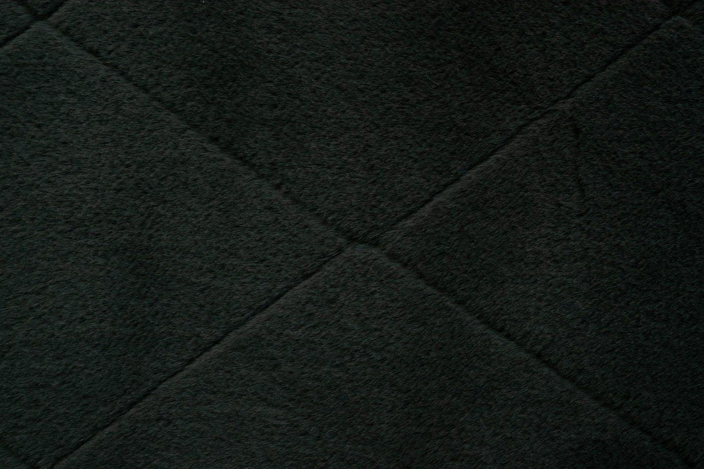 Charcoal plush rug texture with diamond stitch detail