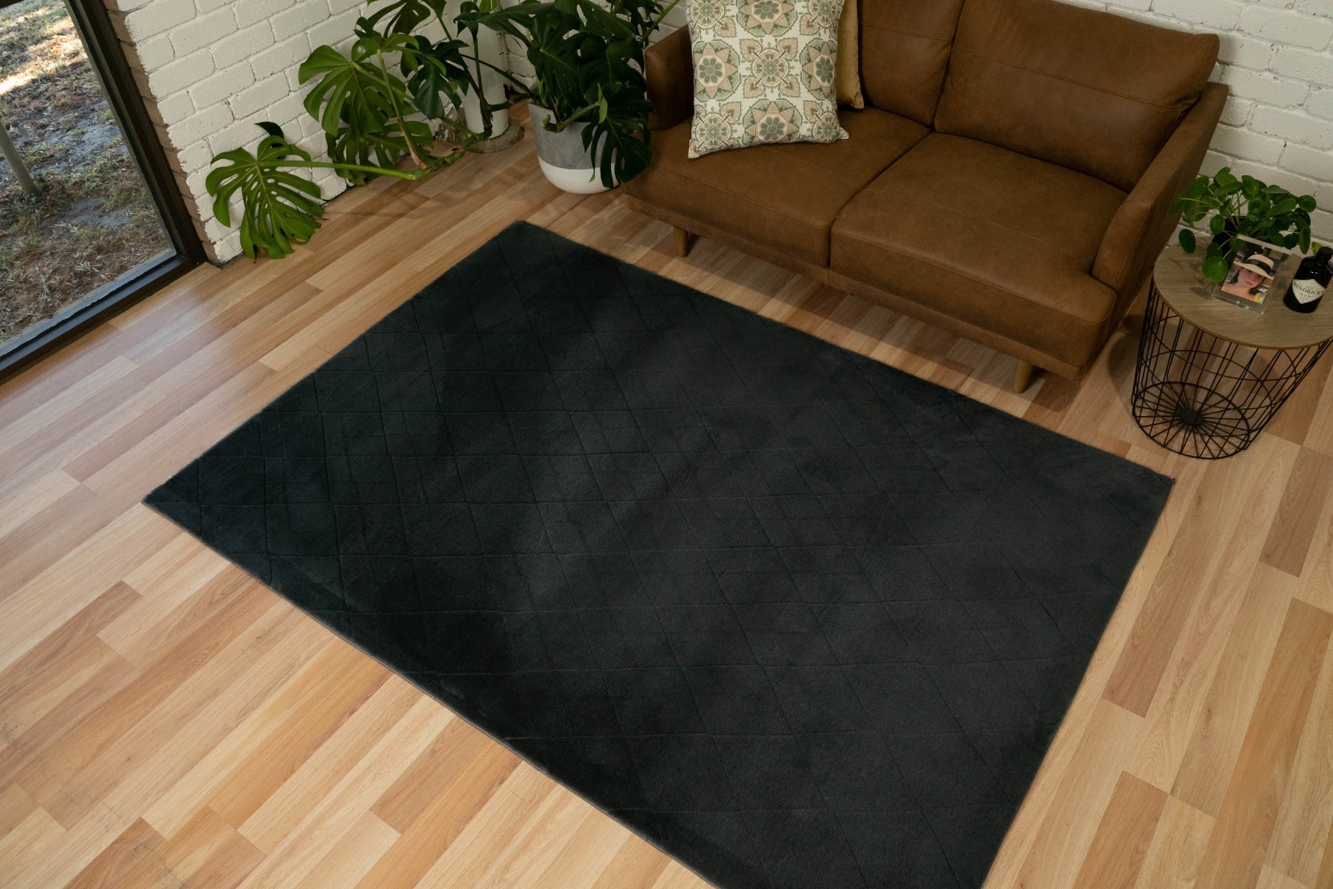 Charcoal shag rug with dark velvety pile and diamond pattern