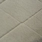 Silver shag rug close-up with soft plush pile and subtle diamond texture