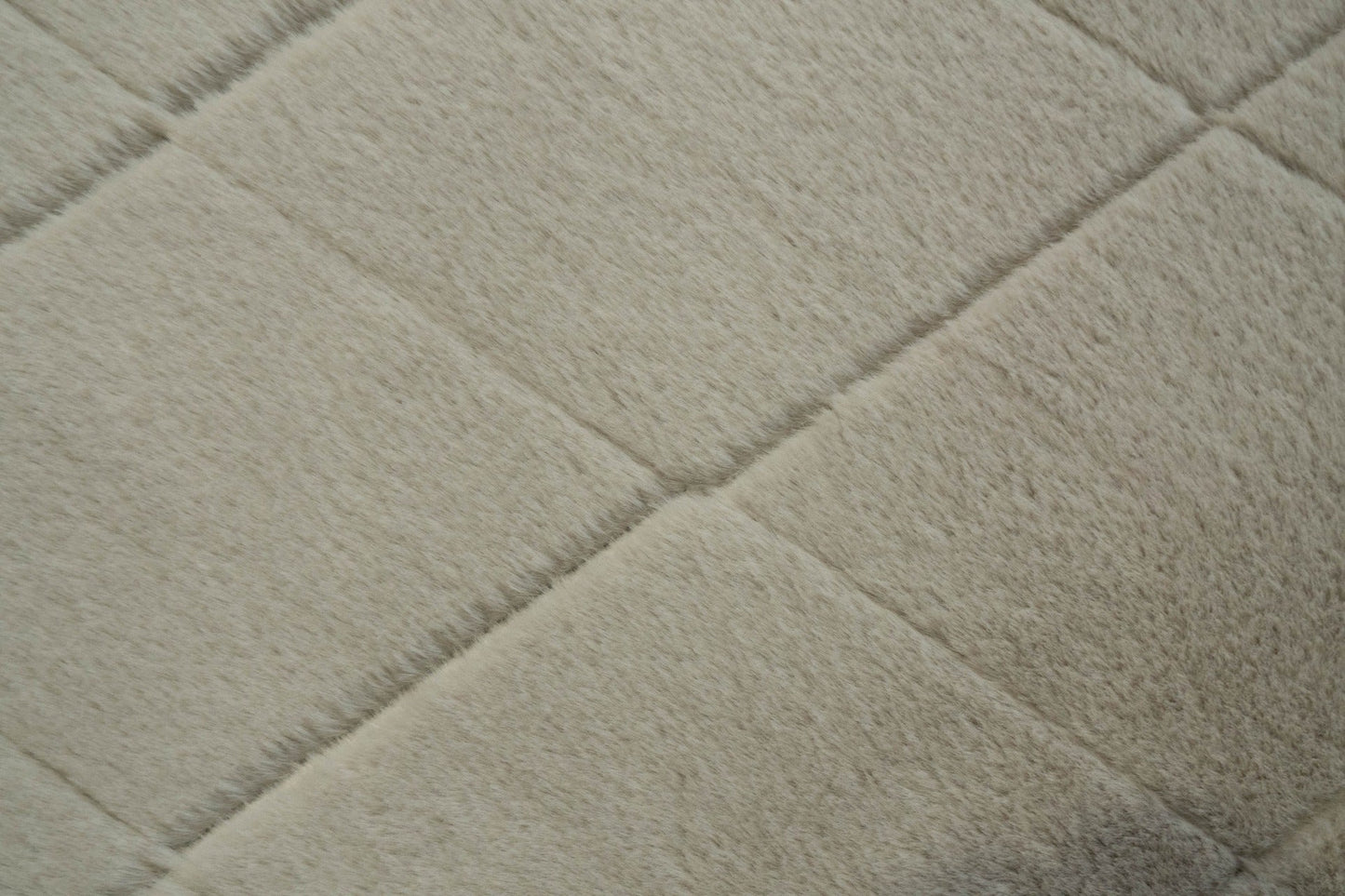 Silver shag rug close-up with soft plush pile and subtle diamond texture