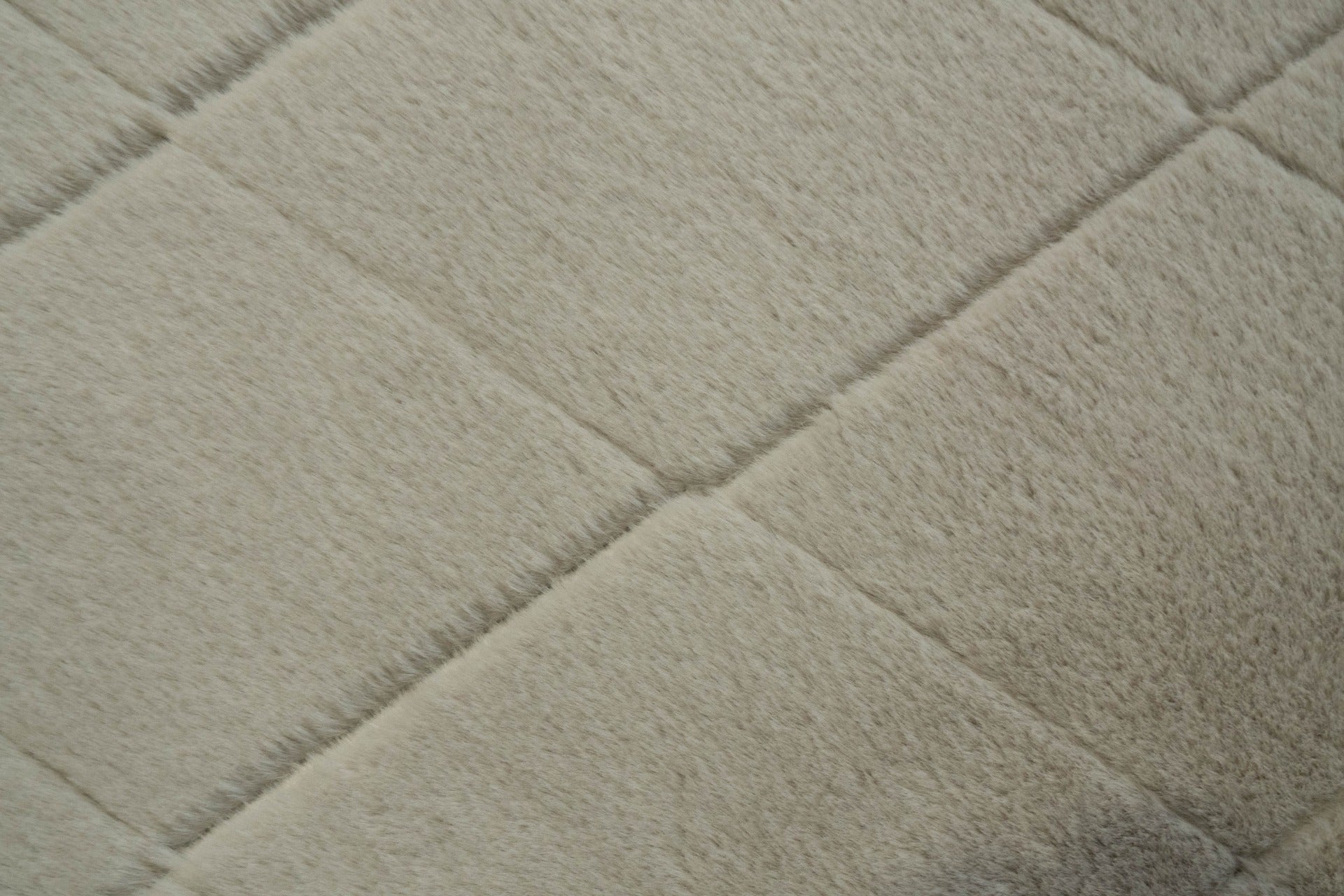 Silver shag rug close-up with soft plush pile and subtle diamond texture