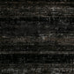 Black area rug with dense speckled texture and mottled gray pattern
