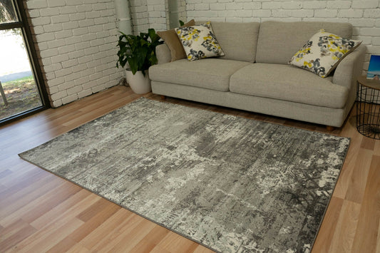 Transitional grey area rug with distressed abstract pattern and border