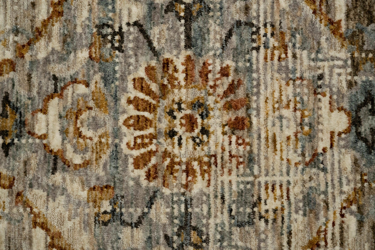 Close-up of multi-colored vintage rug texture with ornate floral motif