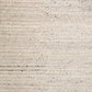 Ivory chunky knit wool floor rug with textured looped pattern