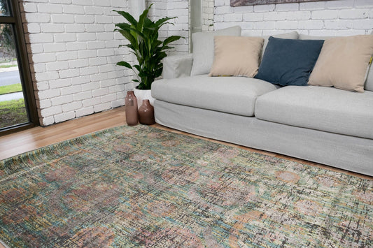 Multicolor abstract area rug with textured weave, shown in living room setting