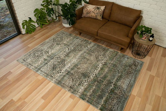 Zarita rug with green and gray ornate medallion pattern, rectangular flatweave